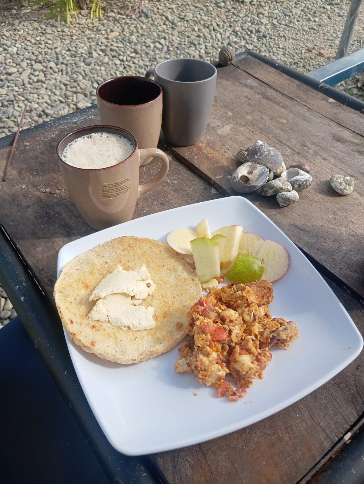Arepa with scrambled eggs and fruit