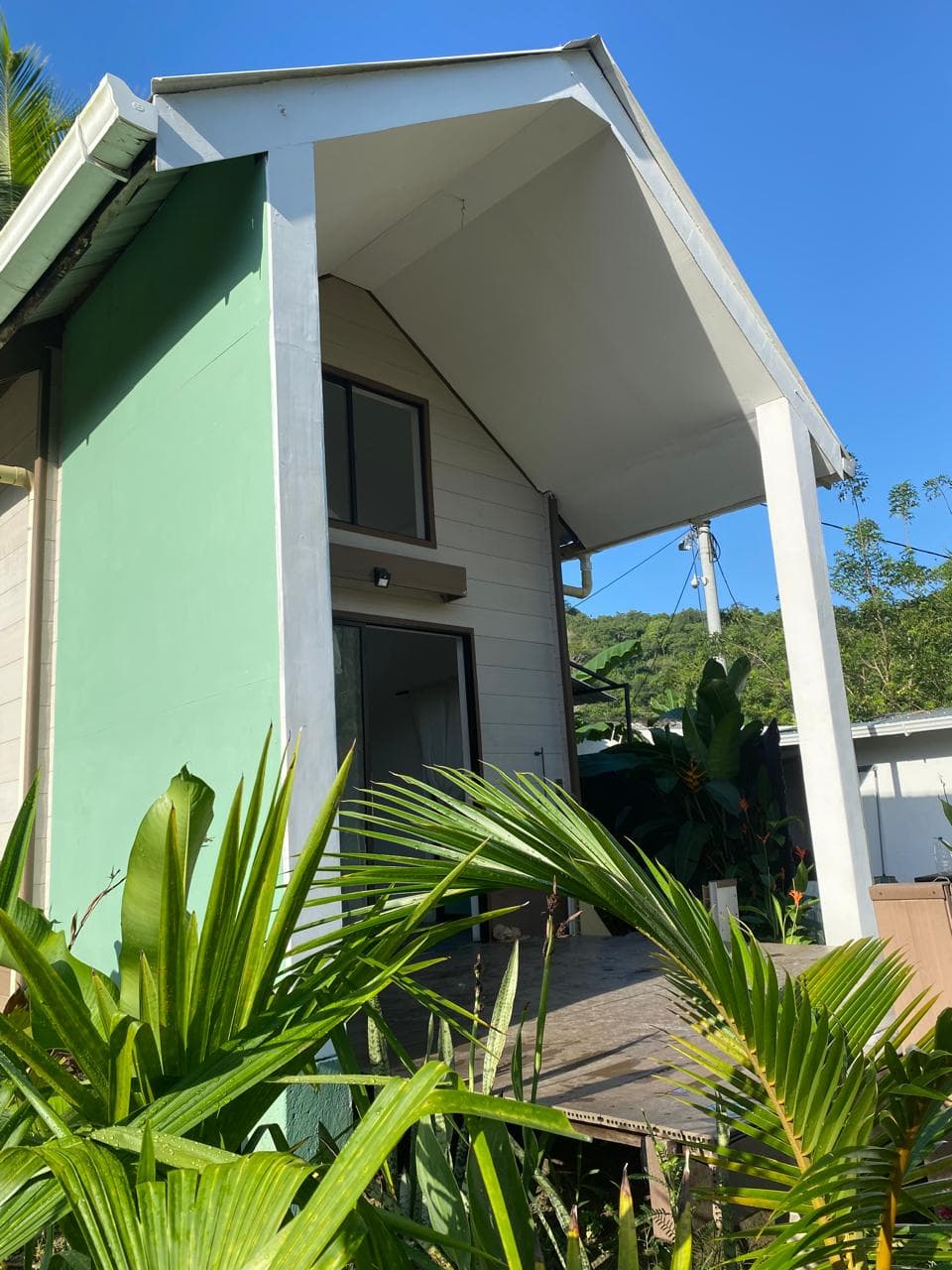 Cabaña Sancibrian — green wall and tropical porch