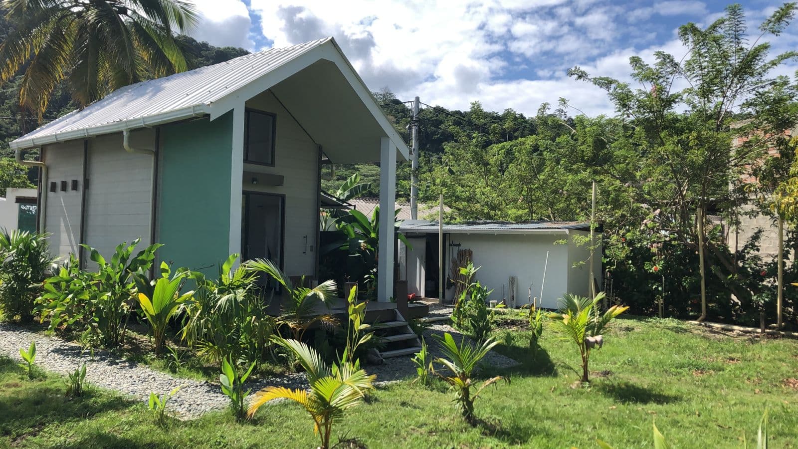 Cabaña Sancibrian — wide view with jungle backdrop