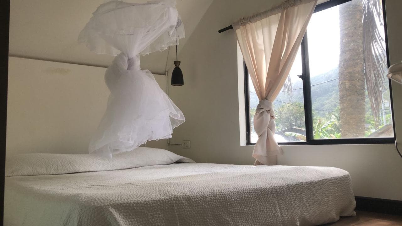 Cabin — queen bed with mosquito net